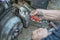 A hand changing a brake pads on a car
