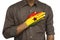 hand on chest making pledge. Hand painted in Ghanaian flag colors.