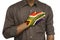 hand on chest making pledge. Hand painted in South African flag colors.