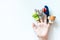 Hand of a child with finger puppets, toys, dolls close up on white background with copy space - playing puppet theatre and