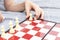 Hand of a child playing chess close up, board games and entertainment concept