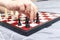 Hand of a child playing chess close up, board games and entertainment concept