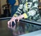 The hand of the child is pressing the touchscreen of the interactive table