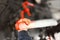 The hand of a child pulling a red lever in the cab of an old steam locomotive FS940, imagining conductor