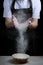 Hand clap of chef with flour on black background isolated