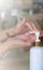 Hand cleaning with alcohol in white plastic bottles to prevent germs and the coronavirus & COVID-19; put on soft edges.