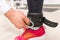 Hand Clipping Fastener to Ankle Strap in Gym