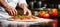 hand closeup of chef preparing italian pizza in kitchen. banner
