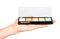 Hand with color palette, eye makeup brush