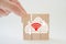 Hand complete cloud icon shape on wood block isolated background for for technology, networking concept