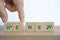 Hand completed green renew word on wooden cube blocks for eco , energy , business strategies, plans and goals