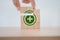 Hand completed green safety first sign on wooden cube blocks with copy space, work safety, caution work hazards, danger