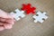 Hand connect white and red jigsaw parts with word problem & solution.   symbol of association and connection. business strategy.