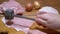 Hand of Cook Beats off a Delicious Juicy Piece of Pork Meat with Kitchen Hammer