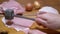 Hand of Cook Beats off a Delicious Juicy Piece of Pork Meat with Kitchen Hammer