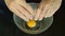 Hand cracked white eggshell in glass bowl on counter kitchen