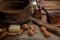 The hand cuts black bread on the background of ingredients for cooking bread