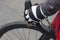 The hand of a cyclist holds the wheel. Close-up photo