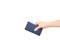 Hand with dark blue power bank for charging mobile devices, external battery