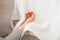 Hand disinfection with soap and water. A woman wipes her hands with a towel after washing with soap