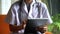 Hand doctor using digital tablet for online treatment