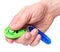 Hand with dog clicker on white