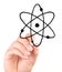Hand drawing atom icon on white background
