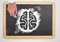 Hand drawing brain icon on blackboard