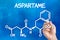 Hand drawing the chemical formula of aspartame