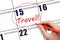 Hand drawing a red circle and writing the text TRAVEL on the calendar date 15 September . Travel planning.