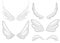 Hand drawn angel, fairy or bird wings set. Outlined drawing elements isolated on white background. Vector illustration