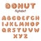 Hand drawn Donut alphabet. Donuts letters glazed by caramel.