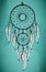 Hand drawn dream catcher with ornamental feathers on grunge gree