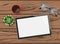 Hand drawn flat lay Mockup of blank tablet, eyeglasses and a cup of coffee on wooden table