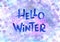 Hand drawn lettering blue winter phrase on Background. hello Winter - Watercolor text and bubble on violet and purple