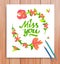 Hand drawn miss you card. Typography and flowers