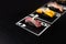 Hand drawn Poker cards with Japanese sushi nigiri on dark chalkboard background. Asian food with tuna tataki, omelette, and black