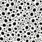 Hand drawn polka dot seamless pattern. Random geometric pebble wallpaper