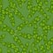 Hand drawn seamless pattern with random bright green tropical banana shapes. Pastel background