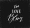 Hand drawn vector ink graphic handwritten calligraphy lettering text Live Love Bloom isolated on black background.Spring