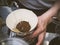 Hand drip coffee Barista pouring water on coffee ground