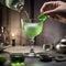 A hand dropping a sugar cube into an absinthe glass with an artistic spoon4