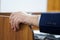 Hand of an elderly man in a formal business suit, conference participant or college teacher. Close-up. Experienced politician,