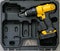 Hand electric tool: a yellow screwdriver in a molded black box