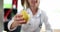 Hand of female nutritionist doctor is holding yellow pear