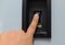 Hand with finger on circuit breaker switch