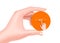 hand with fingers holding an orange circle icon with a picture of hitting the online order button for online shopping