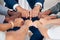 Hand, Fist or diversity business men and women teamwork together in mission, trust or goal in top view. Hands of