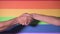 Hand fist with lgbt flag background. Lgbt pride concept. Gender equality concept. Pride flag with fist. Lgbt power concept