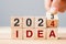 hand flipping block 2023 to 2024 IDEA text on table. goal, Resolution, strategy, plan, motivation, reboot, business and New Year
